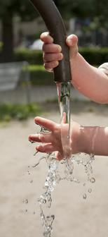 Toddler hands playing with water